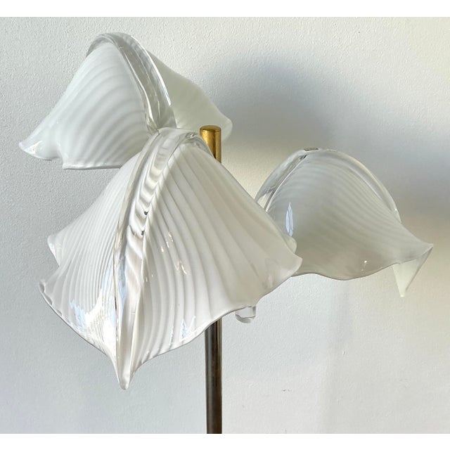 This exquisite vintage Italian table lamp is a masterful display of Murano glass artistry and Hollywood Regency glamour....