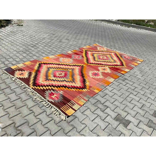 This beautiful, vintage, handwoven kilim is approximately 60 years old. It is handmade, of very fine quality hand spun...