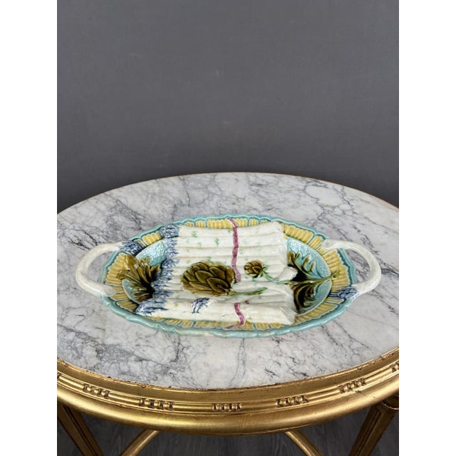This set comprises twelve plates and a serving platter, all crafted from high-quality ceramic and hand-painted, showcasing...
