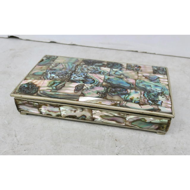 Made in Mexico with abalone patchwork patterns over the top and sides. Beautiful rainbow coloring to the shells. The...