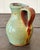 The Vintage Boho Studio Pottery Pitcher showcases the charm of handmade craftsmanship with its rustic glaze and unique...