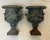 For sale is a matched pair of vintage cast iron planters with side handles and protruding heads of father winter blowing...