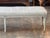 A Louis XVI painted bench, over five feet long, on six turned and fluted tapering legs with carved rosette blocks. Worn...