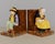 A set of French Art Deco faience bookends produced by HB Quimper and designed by Berthe Savigny (1882-1958). Polychrome...