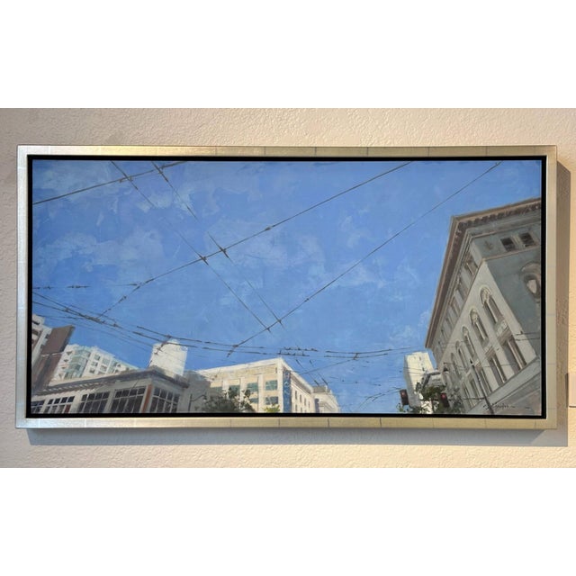 This artwork captures a vibrant urban scene, focusing on the interplay between the expansive blue sky and the intricate...