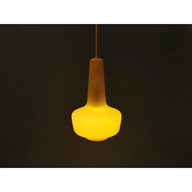 Incredibly rare, large Fog & Mørup glass pendant lamp designed by the famous Jacob E Bang. Model Crete from 1965, and not...