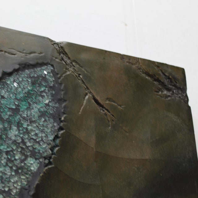 Large wall sculpture features a teal leaf crafted from&nbsp;crushed glass on a&nbsp;hand-textured resin designed to...