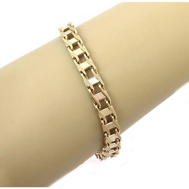 This beautiful vintage bracelet is crafted in solid 14k two-tone gold with a double-sided link design  giving you...