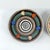 A charming set of three vintage glazed ceramic wall plates dating from the 1950s. Two black plates were produced in the...