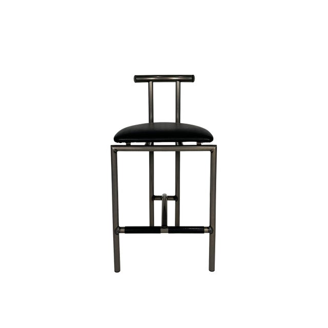 Set of three vintage barstools in the style of Rodney Kinsman's "Tokyo" chair for Bieffeplast. Manufactured by Amisco in...