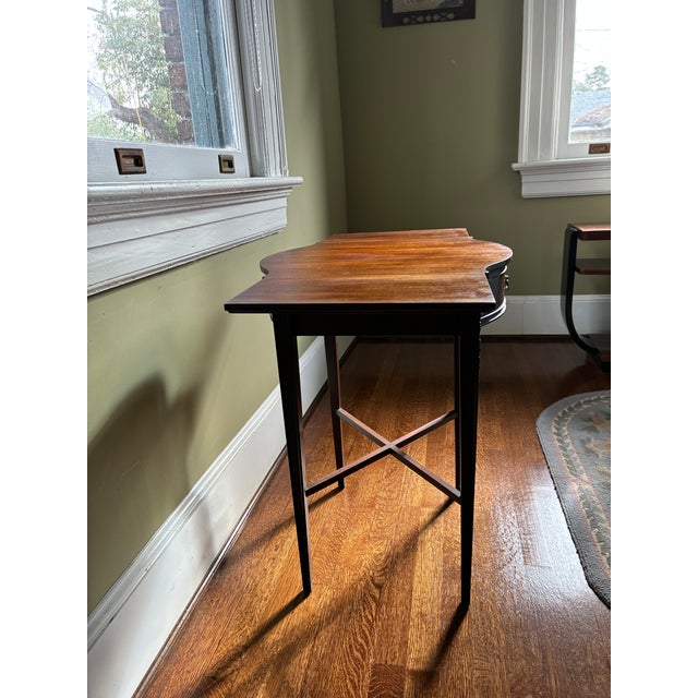 Beautiful mahogany side table made by Craftique in Mebane, North Carolina. Finished on all sides, It has carvings on the...