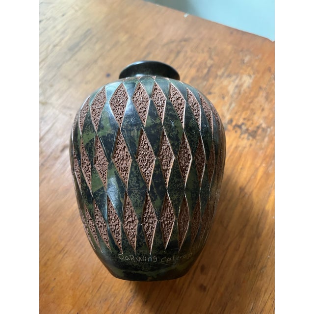 Earthenware Folk Pottery Green polished surface with textured adobe brown clay base. Has a Mod Geometric cut diamond...