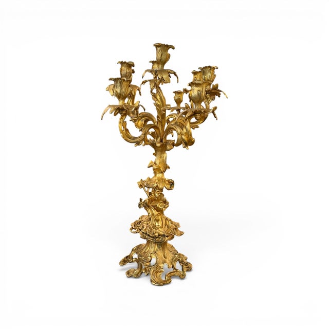 A grand pair of 19th century Louis XV style candelabras, beautifully crafted in richly gilded ormolu with five elegantly...