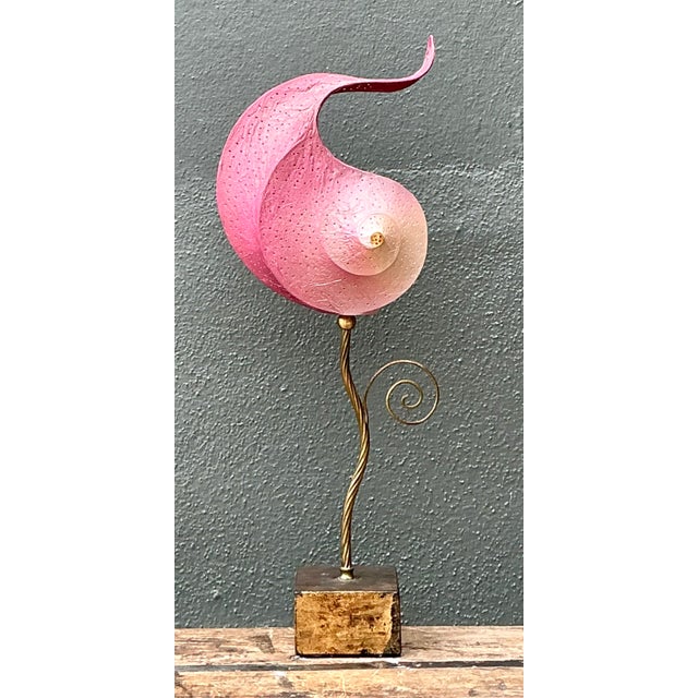 This ethereal accent lamp is a masterwork of Italian artisan design, capturing the delicate beauty of a nautilus shell in...