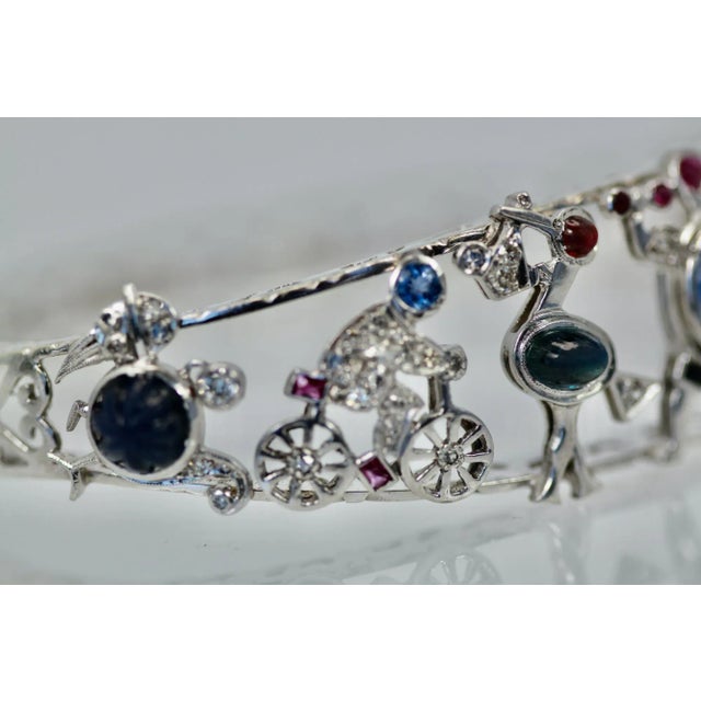 This is part of Chairish’s Fine Jewelry assortment. Art Deco Platinum Charms on Bracelet As we all know the Deco period...