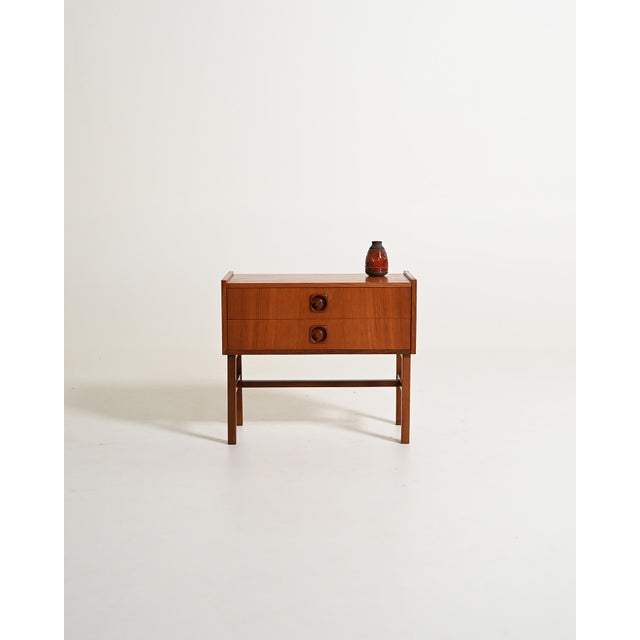 Teak bedside table with two drawers. Scandinavian production, 1960s. Scandinavian bedside table produced in the 1960s. The...