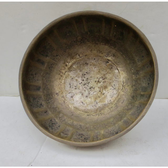 Copper repousse from Kashmir. Early 20th century, possibly a late 19th-century bowl. Lobed walls with lotus-petal panels...