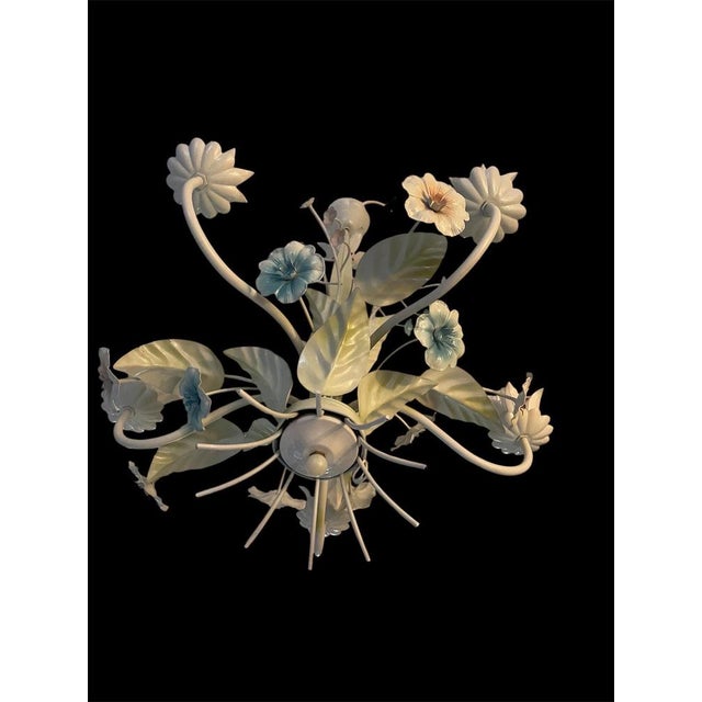 Spain painted metal floral chandeliers from the 1970s, with models such as ceiling lights and pendant lights featuring...