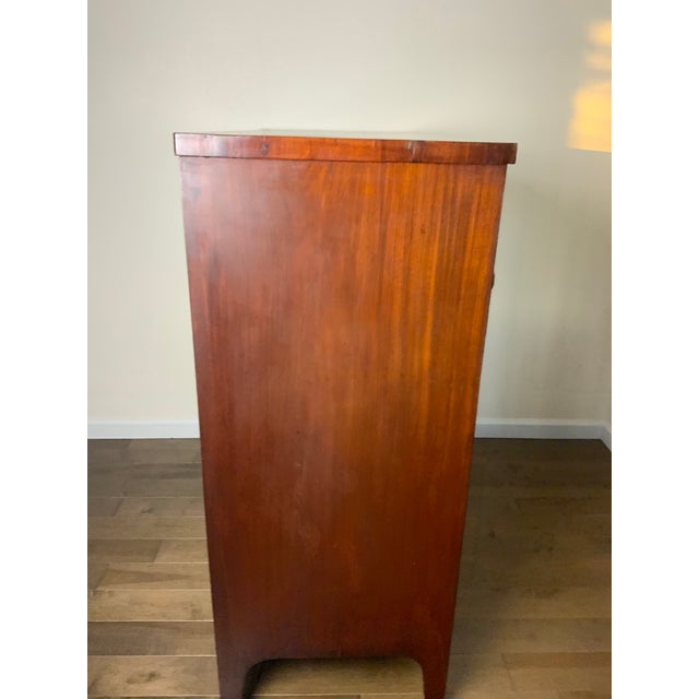 Federal Mahogany Hepplewhite tall chest. Nicely scalloped cut apron and tall French feet. Sometimes used as dining room...