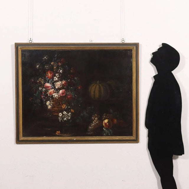 Oil on canvas. Lombard school of the late 1600s-early 1700s.The rich composition features a large bunch of multicolored...