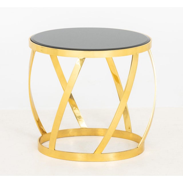 Karl Springer Beveled Black Glass Top and Gilt Brass Barrel End Table, unmarked. 17.25" H x 18" W x 14" D. Provenance:...