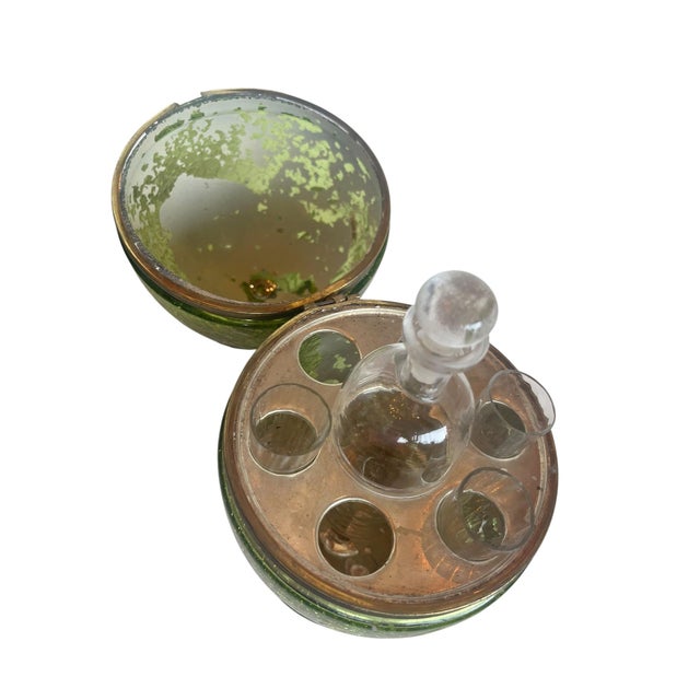 An enchanting 19th century French mercury glass liqueur cave fashioned in the form of an oversized egg. The shimmering...