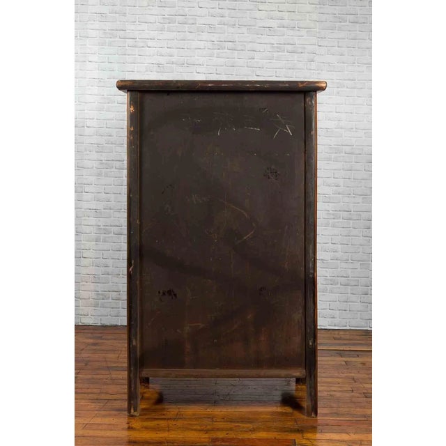 A large wedding cabinet from the 19th century, with two pairs of double doors and large butterfly hardware. This armoire...