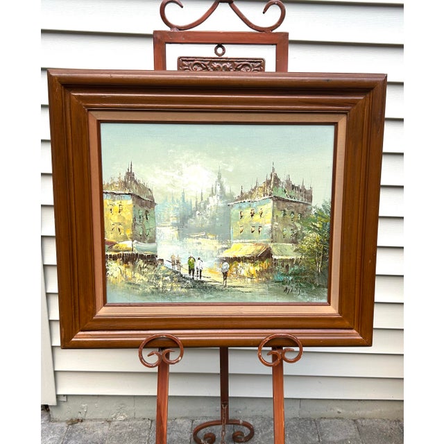 This mid-century, original, oil/acrylic Parisian themed painting, done on stretched canvas, seems to be a depiction of a...