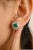 This is part of Chairish’s Fine Jewelry assortment. These exquisite stud earrings feature vibrant emeralds at the center,...