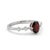 This elegant ring features a striking Garnet gemstone, admired for its deep red hue and rich, fiery brilliance. Known as...