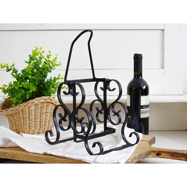Adorable French countertop wine bottle holder, made of hand wrought iron with black enamel coating. Lovely scrolls pattern...