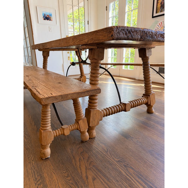 Gorgeous antique dining table with detached bench seating and all the details: bobbin-turned legs, a curved iron...