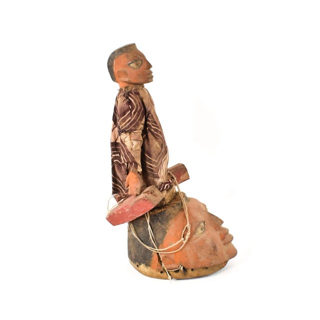 The Gelede mask, originating from the Yoruba people living along the southwestern Nigerian and Beninese border, showcases...