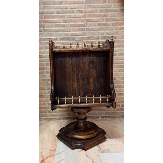 A nautical-style rotating bar table from the early 20th century, of Italian origin. Made of olive wood with brass...