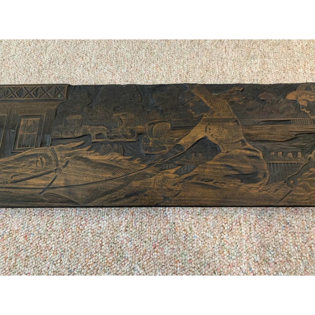 Hand carved wood panel of horses.