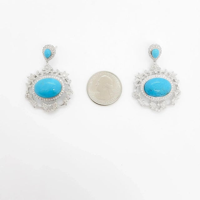 Gorgeous big turquoise cabochons with 2.00 ct. good quality white diamond rounds. Handmade in 18k white gold. These dangle...