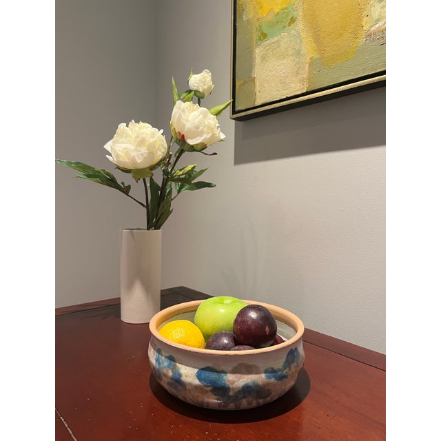 Really pretty handmade ceramic bowl with floral design. Can be used as a decorative or serving piece.