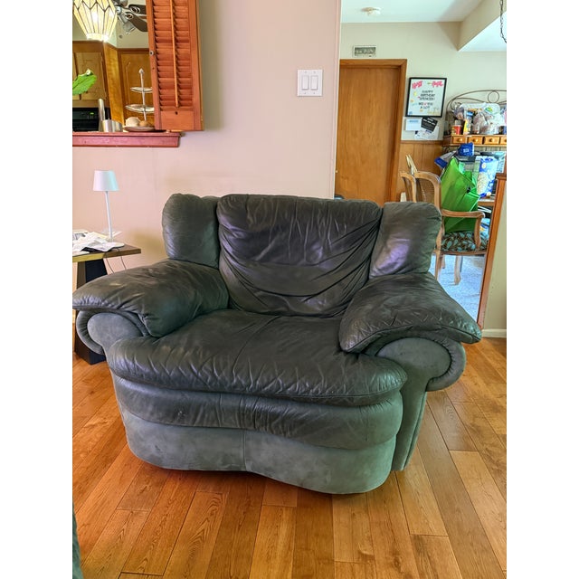 This is a vintage Natuzzi chair and ottoman set from 1996. One owner in a smoke free home. There is patina in the leather...