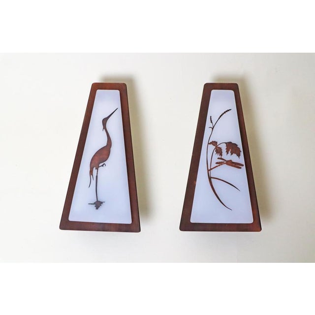 This is a one-of-a-kind set of two wall lamps that are as rare as they are beautiful. The first lamp features a finely...