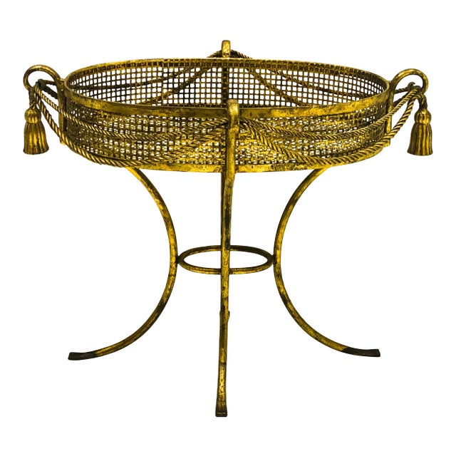 This is a large scale Hollywood Regency gilt tassel gilt metal planter. This is a fun piece as we approach the holiday...