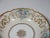 Hand painted Limoges France porcelain bowl. The bowl has a gold painted scalloped edge. The inside is decorated with...