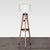 This Pottery Barn floor lamp features a sturdy wooden tripod base with a built-in shelf for added convenience. The lamp...