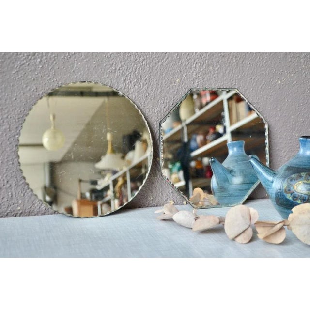An octagonal, a round, here is a pretty pair of vintage mirrors with art deco accents. They have a nice beveled and...