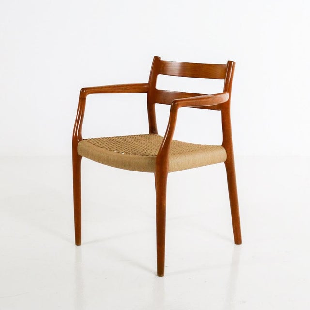Beautiful dining chair 'Model 67' by the Danish designer Niels Möller. The 1960s design features a solid teak frame and a...