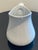 This elegant white ceramic pitcher features a timeless, minimalist design that complements any table setting. Its smooth,...