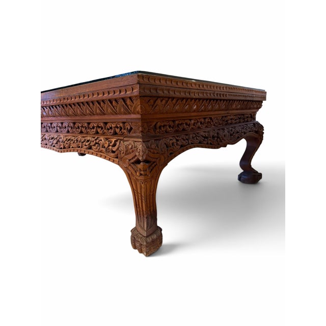 Bring unparalleled artisan craftsmanship into your living space with this striking, vintage low-profile coffee table....