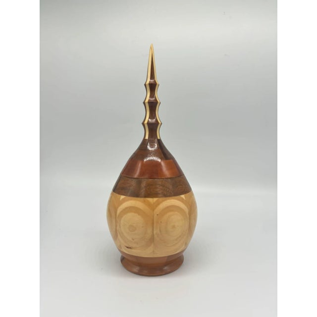 Presenting a stunning Hand Carved Marquetry Inlay Pear Shaped Vessel with Lid. Crafted with precision and care, this...