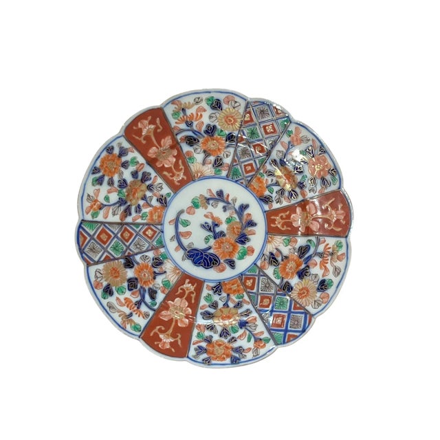 Pair of scallop rim Imari plates. Beautiful hung on a plate wall. Each plate is marked.
