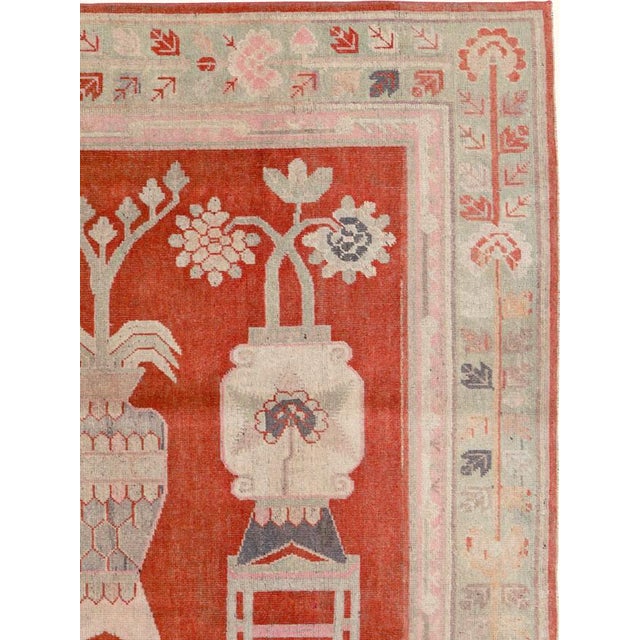 An antique East Turkestan Khotan rug from the early 20th century. Measures: 5' 4" x 8' 10"