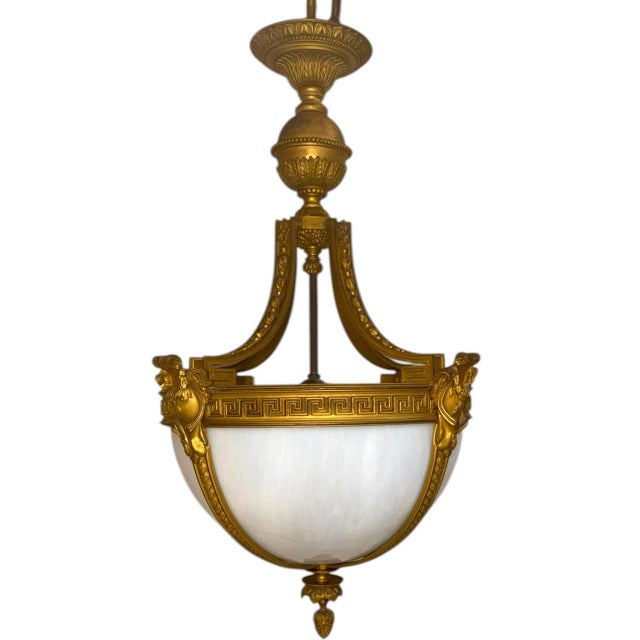 Circa late 19th century bronze and glass neoclassical style light fixture with interior lights